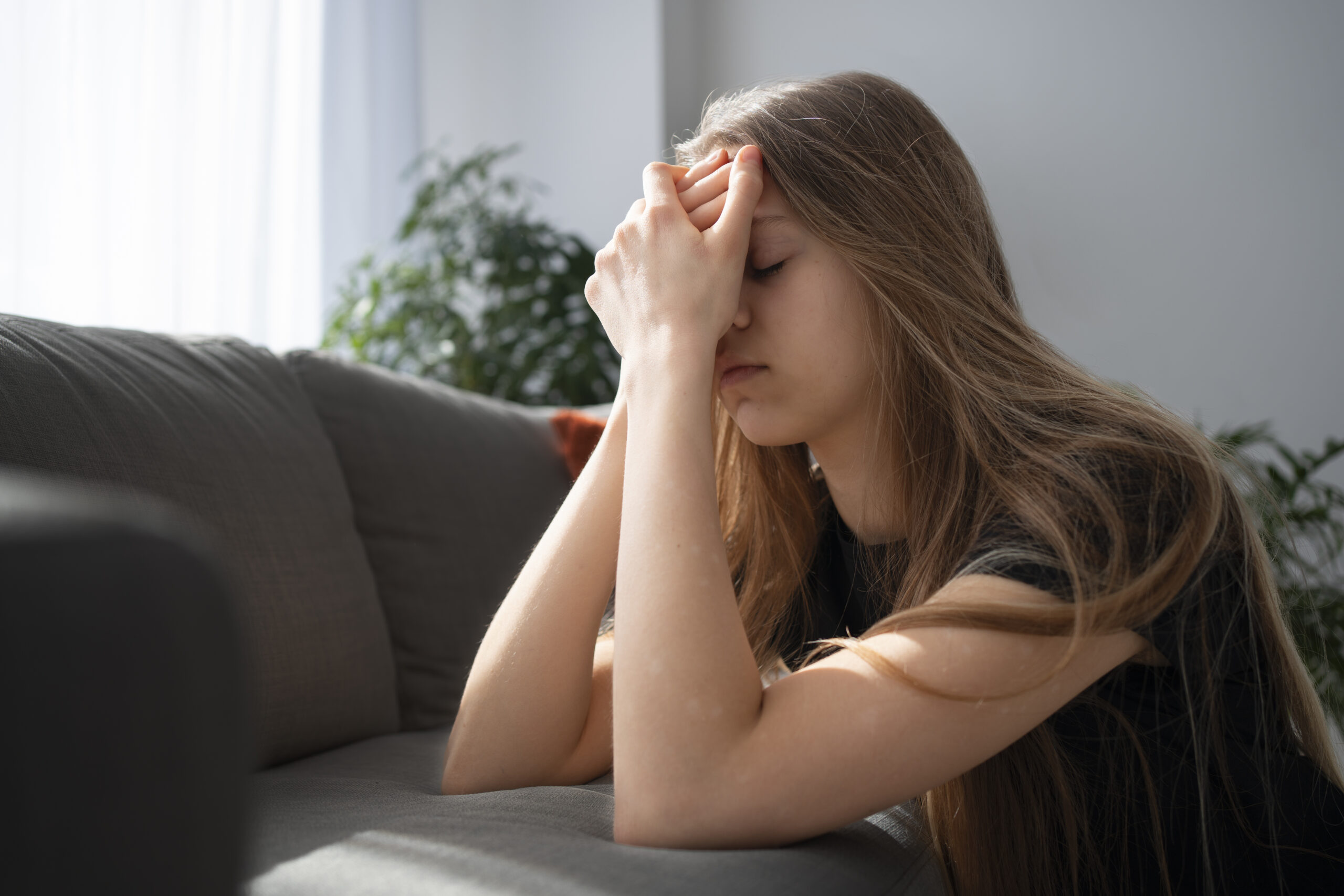 sad-young-woman-home